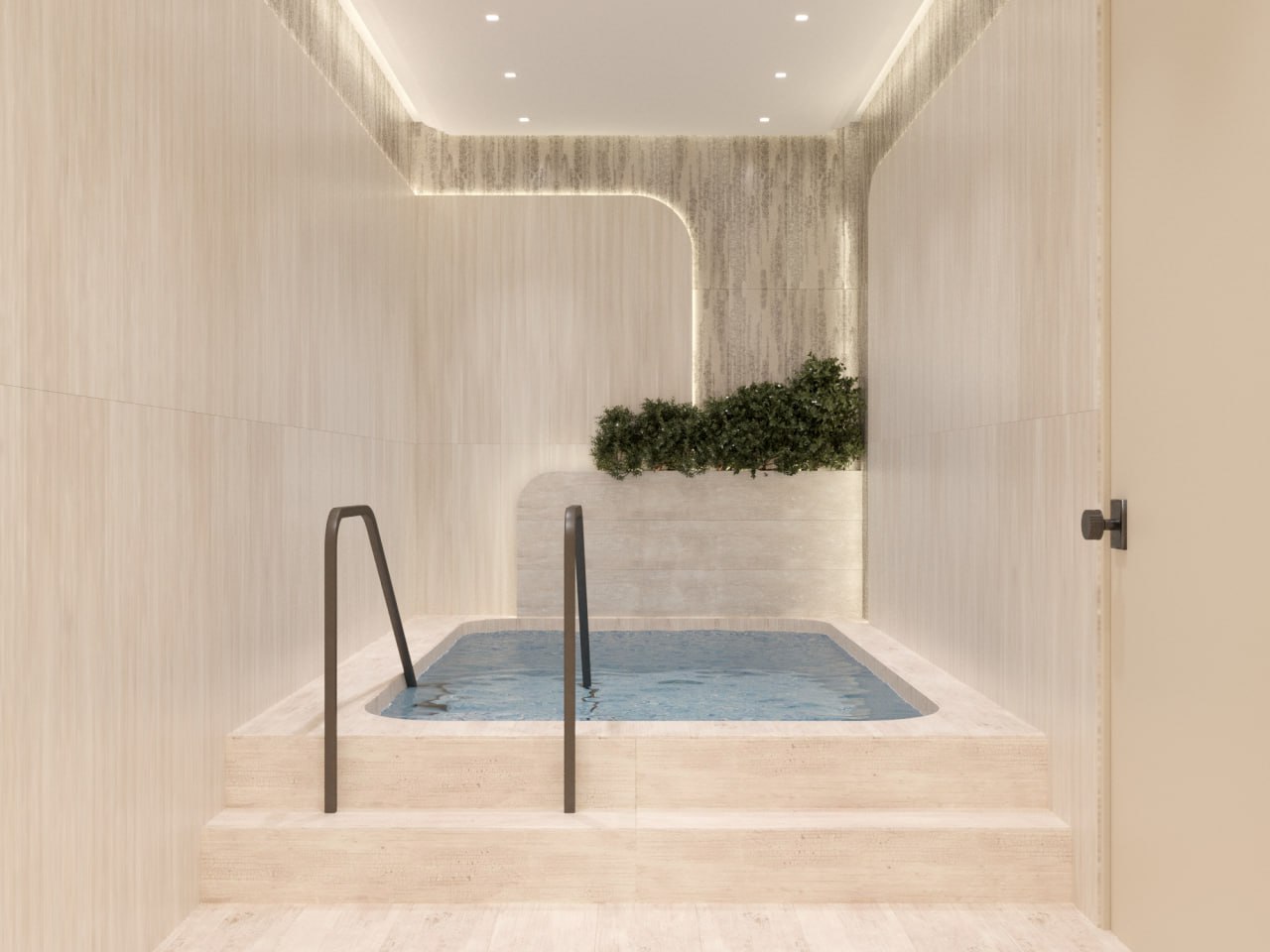The mikvah pool set in warm travertine with gentle lighting